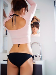 Bambi Watanabe in small black bikini posing her natural boobs