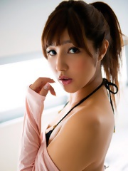 Bambi Watanabe in small black bikini posing her natural boobs