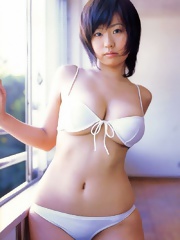 Big tits asian Hitomi Kitamura posing in white lingerie