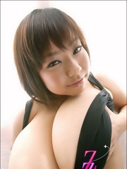 Fuko posing her moster tits in a black bikini
