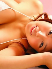 Harada Orei posing in white bikini her natural big breasts