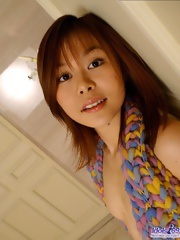 Japanese harlot loves pulling her shirt up to show off her firm tits and pussy