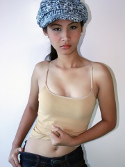 Nude Filipina model Nelly struts her nubile body for the camera
